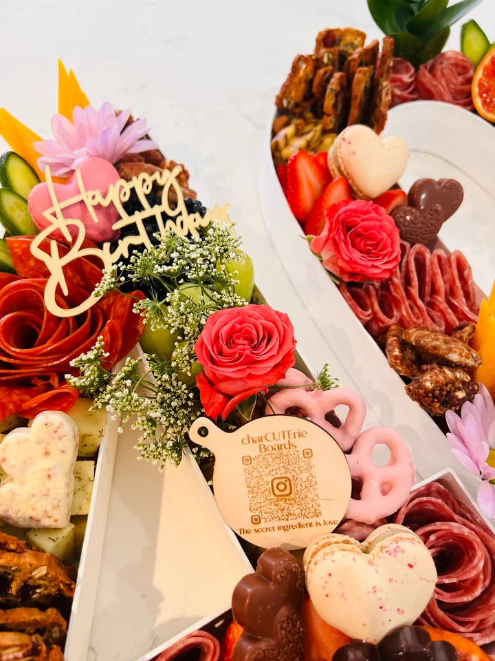 Pair of custom birthday charcuterie boards with floral accents